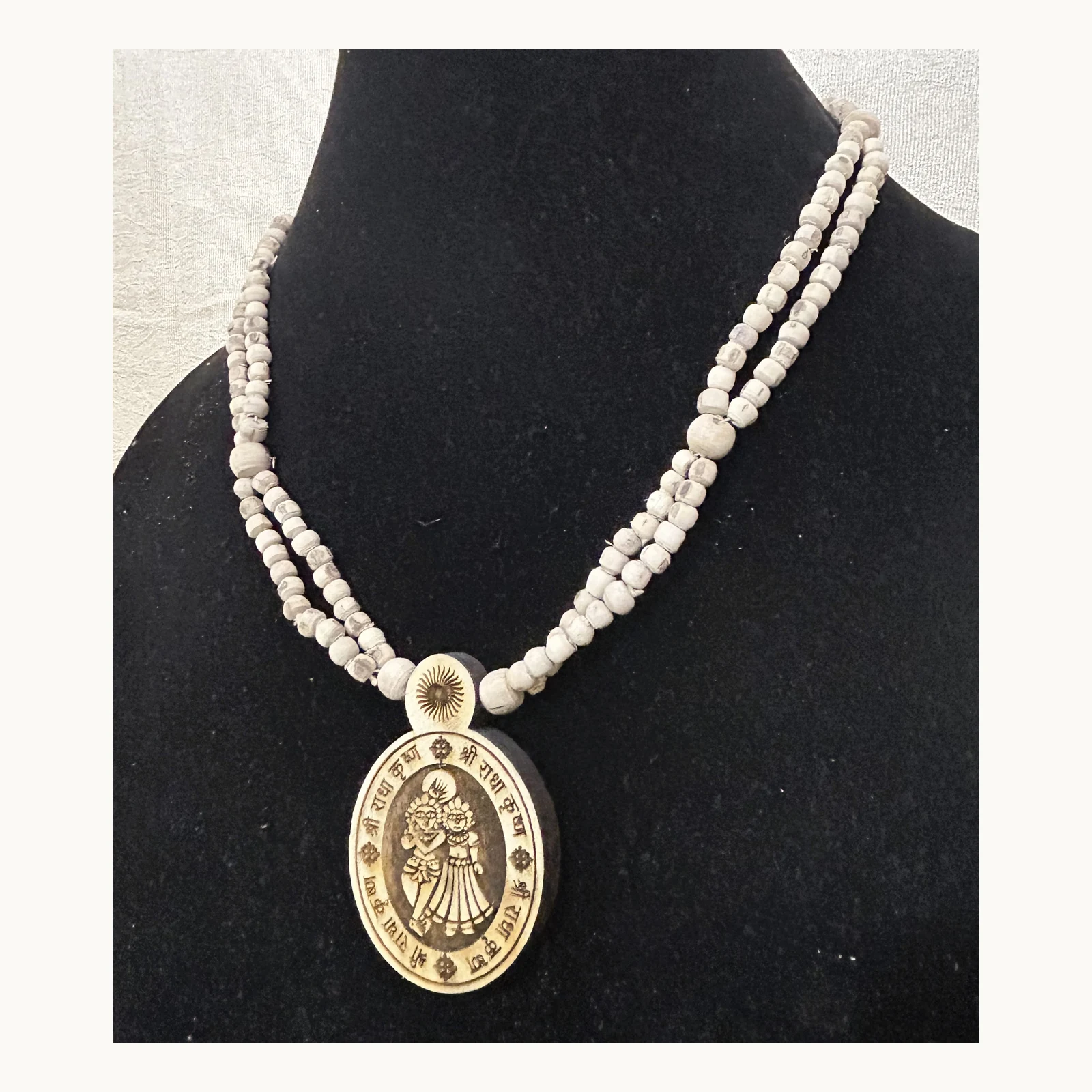 Natural Tulsi double-chain mala with Radha Krishna pendant angle view